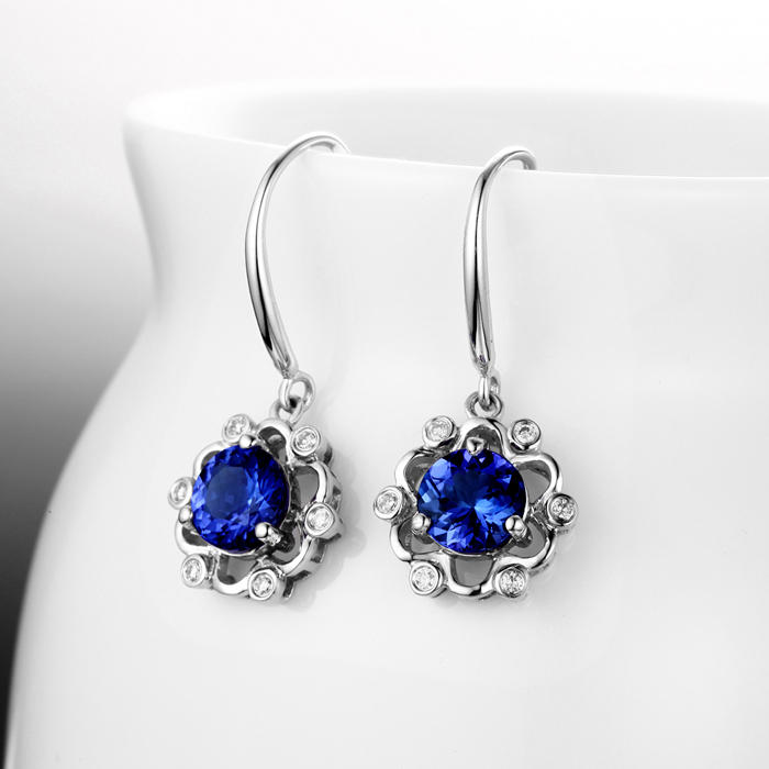 Goldene Ohrringe mit Tansanit und Diamanten 3684