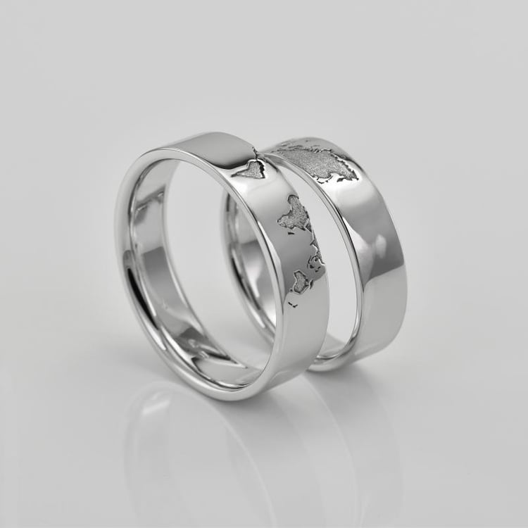 Platin-Trauringe mit Gravur der Kontinente und Diamant Zeoni 76587