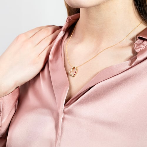 Goldene Anhänger in Herz-Form mit Rubinen und Diamanten Tanish