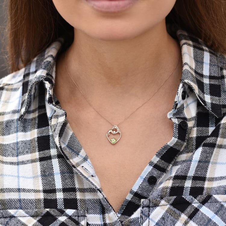 Anhänger aus Gold Mutter und Kind mit Olivin und Diamanten 35303