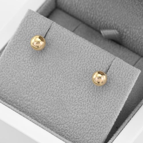 Goldene Ohrringe in Kugelform Bendy