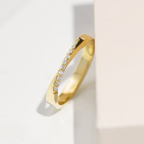Verdrehte goldene Eheringe mit Diamanten Brielle