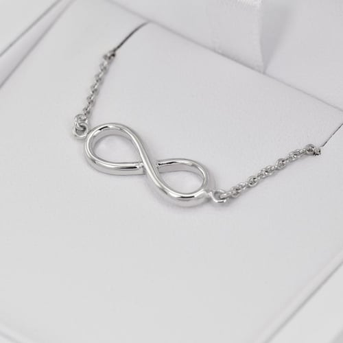 Schmuckset aus Gold mit Unendlichkeitszeichen Infinity
