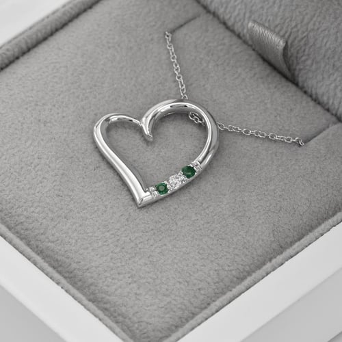 Anhänger in Herz-Form aus Gold mit Smaragden und Diamant Tanish