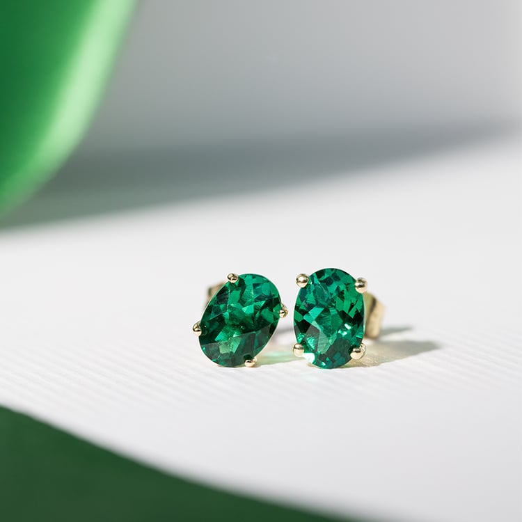 Goldene Ohrringe mit ovalen Smaragden Qati 121891