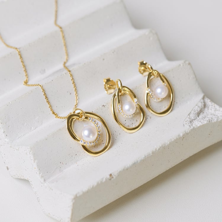 Silbernes Schmuckset mit Perlen und weißen Topasen 164102